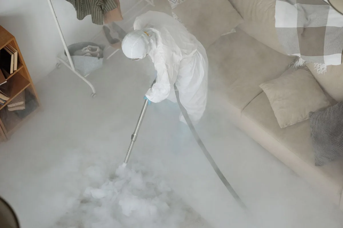 Biohazard cleanup technician in protective equipment, Wisconsin Rapids, WI